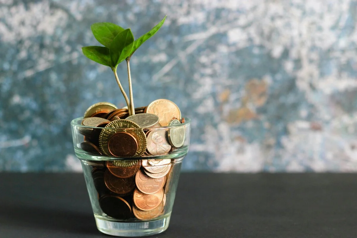 A balanced stack of stones on a solid foundation with a calm background, symbolizing financial stability and conservative investment approach