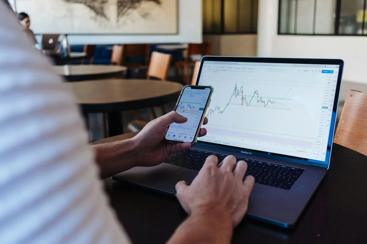 Financial trader analyzing options charts with protective shield overlay, representing options hedging strategies