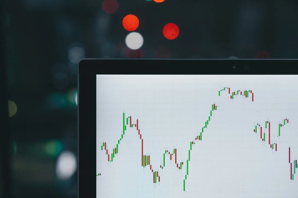 Bear market visualization with downward trending chart and protective shield, illustrating portfolio protection strategies during market downturns