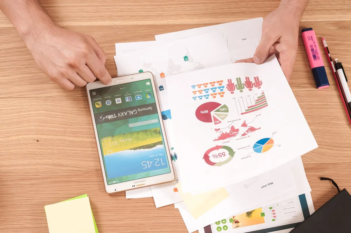 Comprehensive retirement planning materials with financial charts, calculator, and notebook showing organized approach to retirement preparation