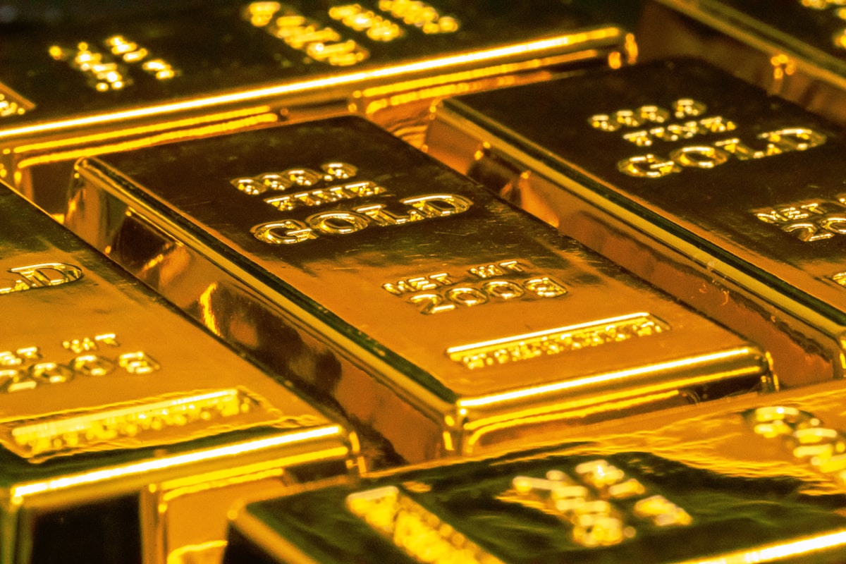 Gold bars stacked representing precious metal investment and safe haven assets